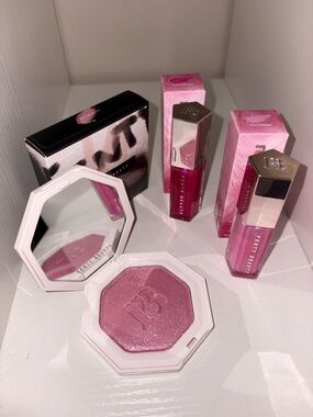 Fenty Beauty Wattabrat glosses and highlighter.